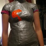 Used more tape to smooth out the form.  She wanted some color on her dress form, so we just slapped on some orange duct tape.